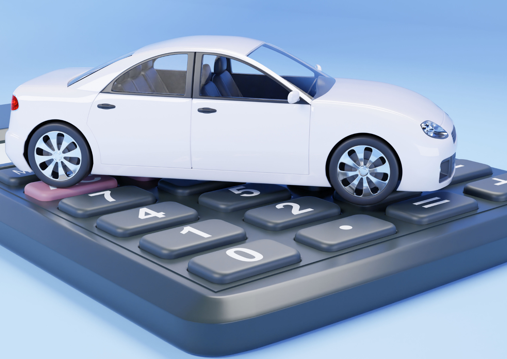 White car parked on top of a calculator